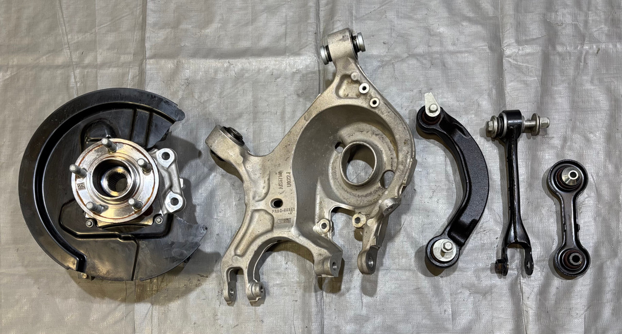 IMG_8156__45094.1777476915.jpg 2024-2025 Ford Mustang GT S650 OEM Driver Rear Knee Spindle Hub w/ Control Arms / 3k Miles FM202 - Image 1